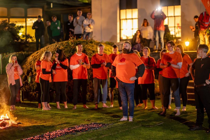 Firewalker preparing to walk on red hot coals
