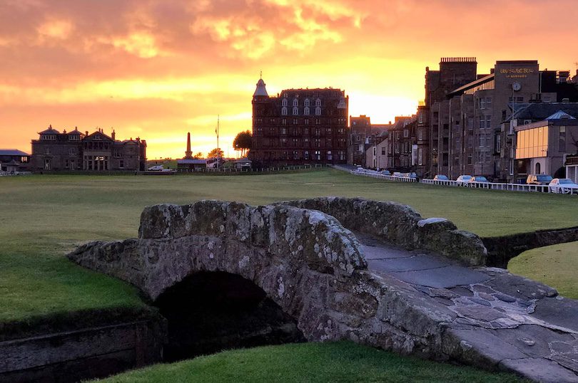 The Swilcan Bridge on the 18th fairway of the Old Course at St Andrews, representing the transition and threshold between a long journey and a meaningful finish.